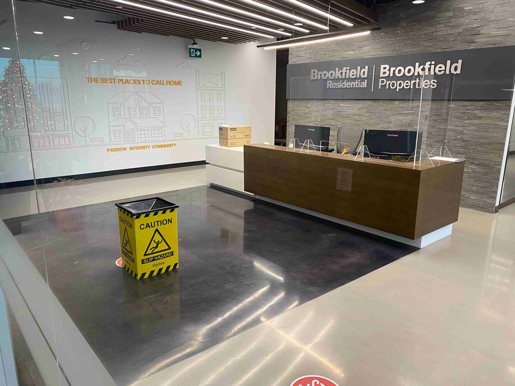SlipStop leak-capturing bucket in a commercial lobby